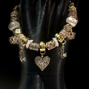 Elegant Gold and Silver Charm Bracelet